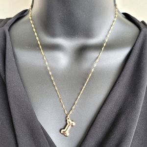 18 karat gold plated stainless steel wavy 18-20" necklace with dog bone pendant